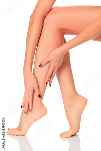 Well-groomed female legs after depilation procedure