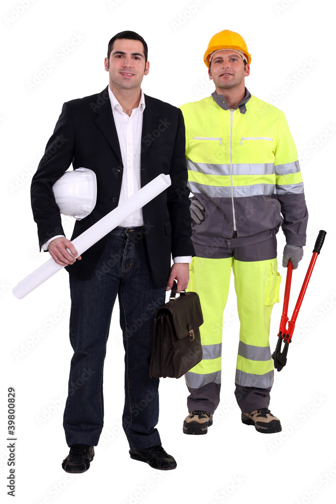 Tradesman and engineer standing side by side Tradesman and engineer standing side by side