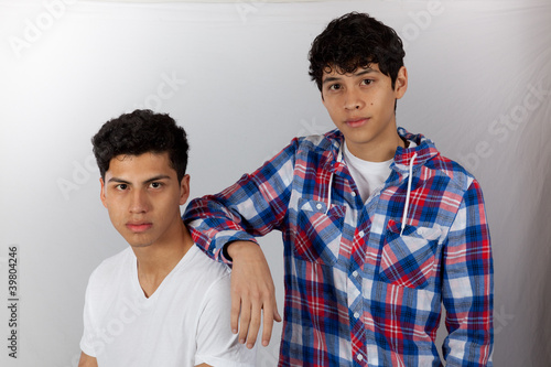 Hispanic brothers standing toether photo