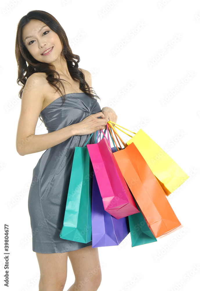 Beautiful stylish woman holding shopping bags in both hands