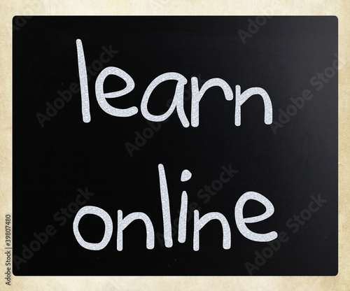 "Learn online" handwritten with white chalk on a blackboard