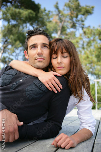 couple embracing outdoors © auremar