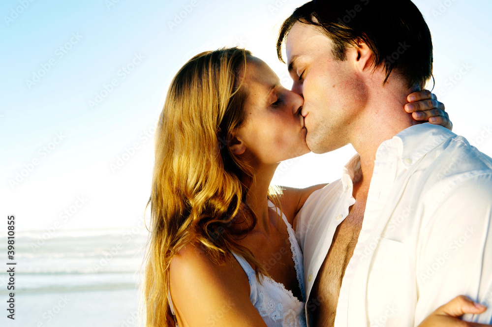 Newlywed couple kissing on honeymoon beach Newlywed couple kissing on honeymoon beach