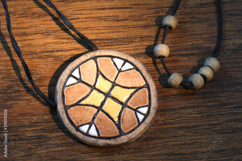 Fotografia Ethnic handmade clay amulet