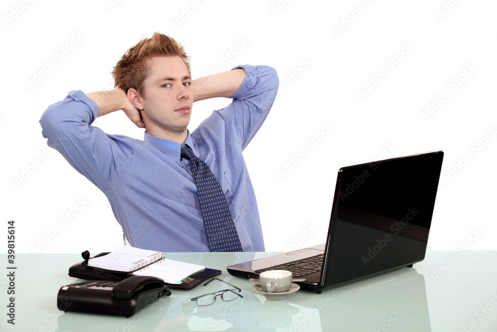 Young banker in front of a computer Young banker in front of a computer