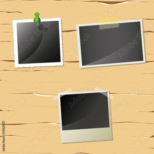 three pictures on the wooden wall