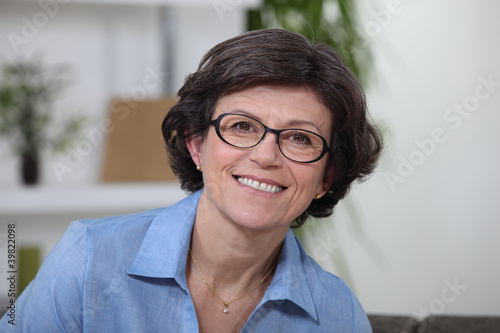 Portrait of a middle-aged smiling woman photo