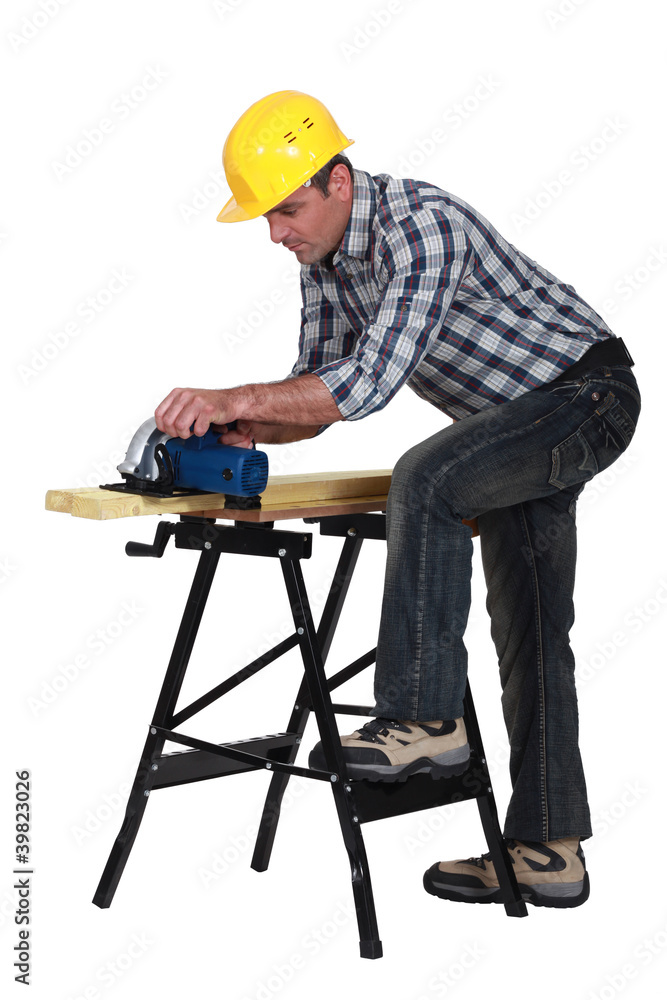 craftsman working on a wooden board craftsman working on a wooden board