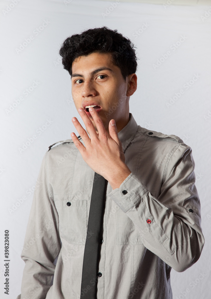 Hispanic man in shirt and tie, looking surprised Hispanic man in shirt and tie, looking surprised
