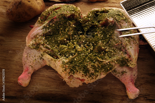 Raw chicken with herbs Rohes Huhn mit Kräutern photo