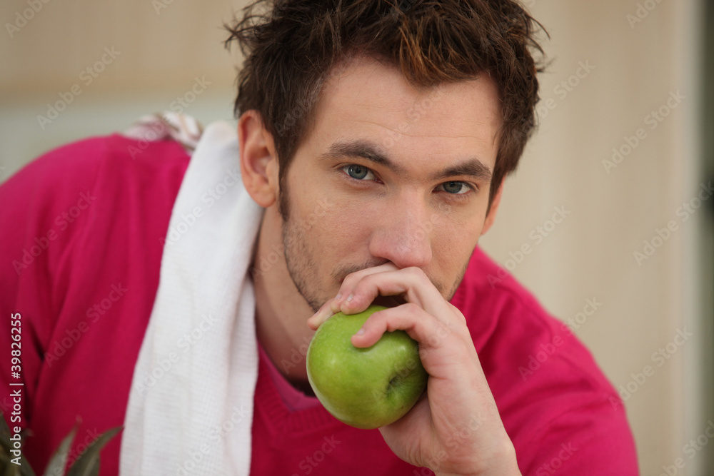 Man about to eat an apple Man about to eat an apple