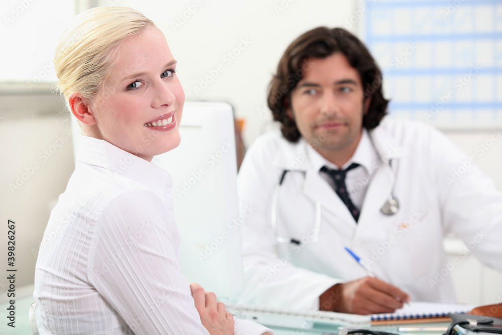 woman consulting her doctor woman consulting her doctor