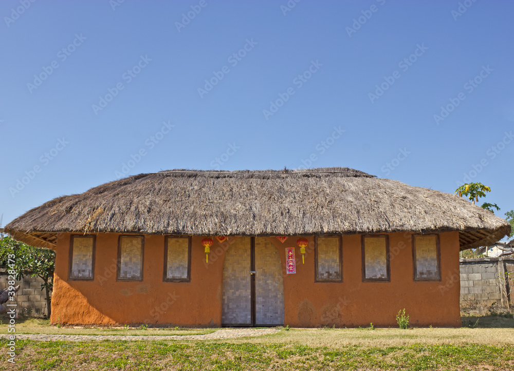 House made ​​of clay at Santichon village in Pai, Mae Hong S