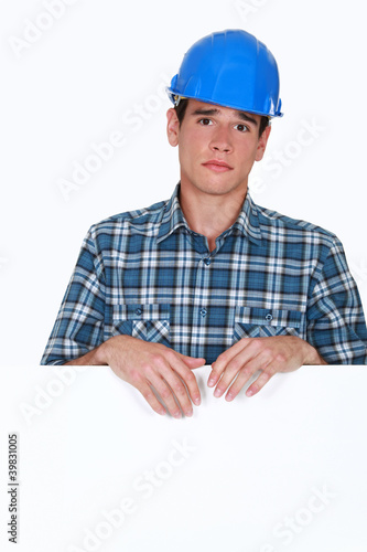 portrait of young blue collar posing behind copyspace