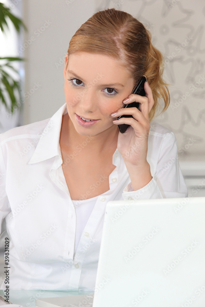 young businesswoman talking on the phone