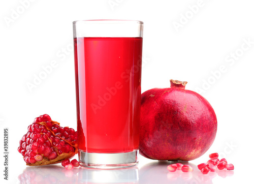 ripe pomergranate and glass of juice isolated on white.
