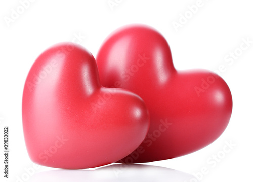 two decorative red hearts isolated on white. © Africa Studio