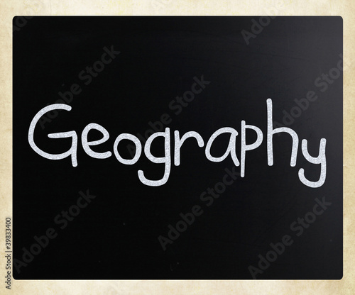"Geography" handwritten with white chalk on a blackboard