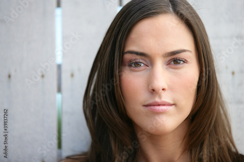 Closeup of a young woman with long brown hair