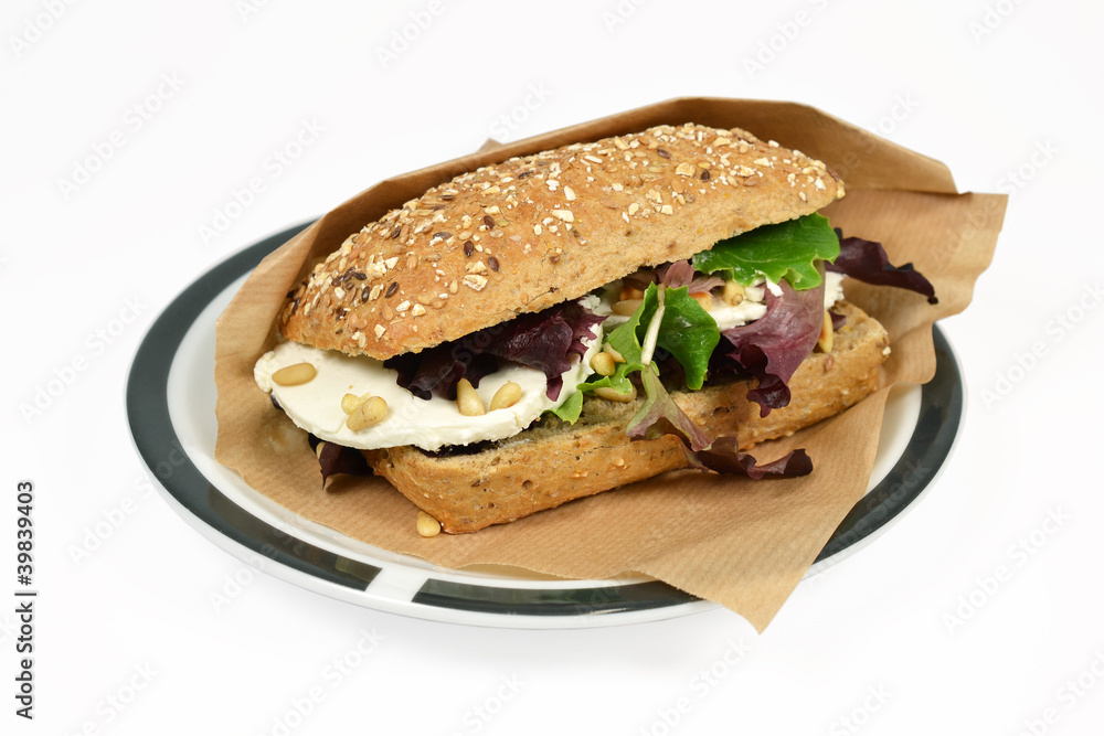 Roll ewe cheese with lettuce on a white context. Roll ewe cheese with lettuce on a white context.