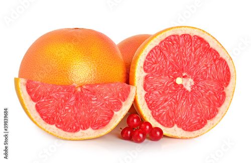 Cut grapefruits and berry