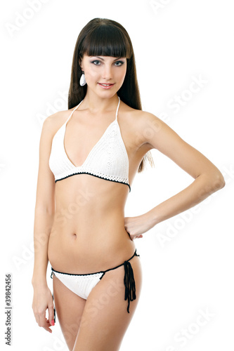 Sexy underwear model posing in a studio in a handmade swimsuit