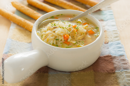 Chicken rice soup with bread stick