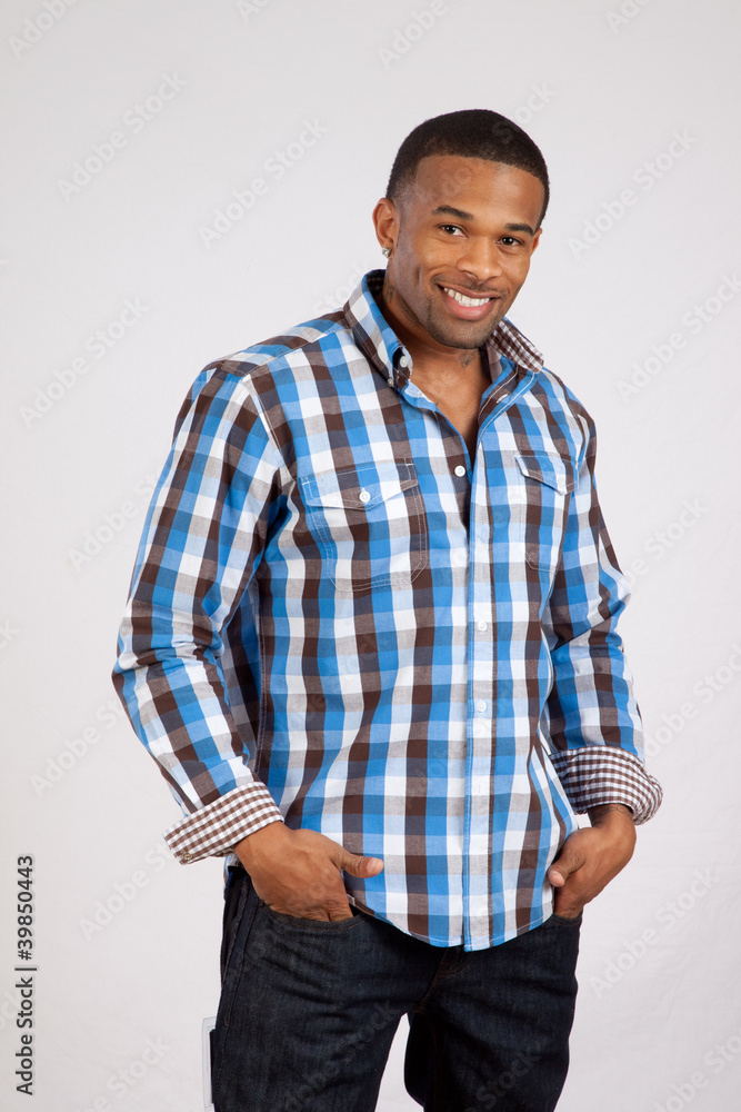 black man in plaid shirt looking at camera black man in plaid shirt looking at camera