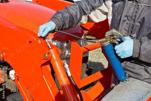 Greasing Tractor Piston