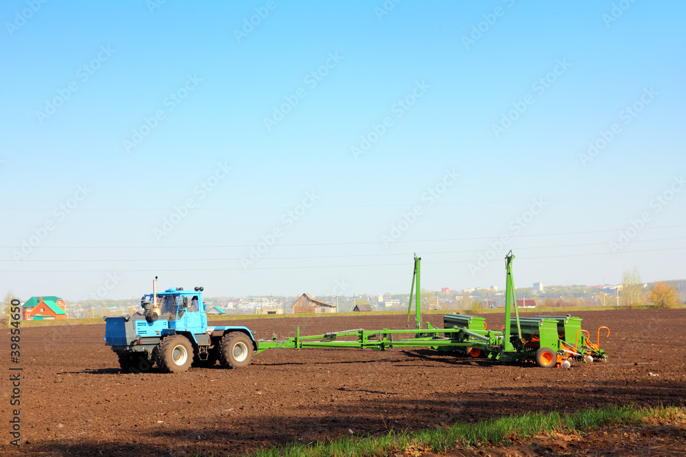 Obraz premium agriculture tractor with drill