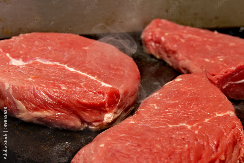 Steak on industrial grill