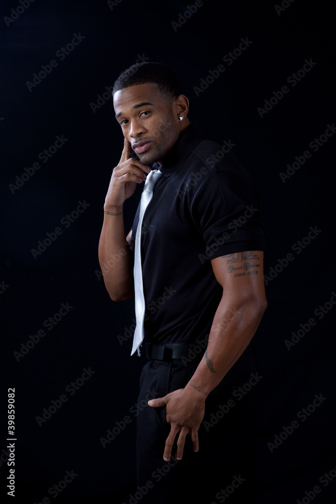 black man in black shirt , with serious look