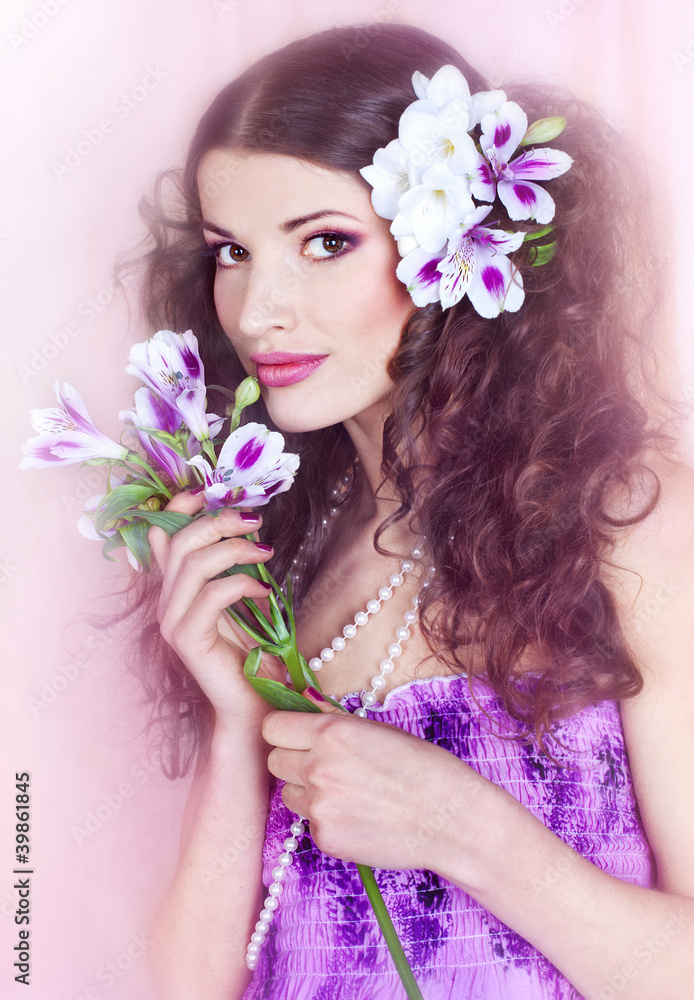 Portrait of the young, beautiful brunette in a lilac dress and w Portrait of the young, beautiful brunette in a lilac dress and w