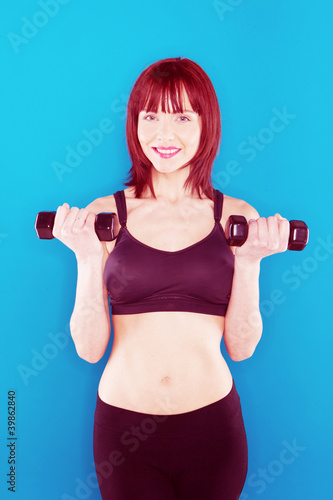Woman Holding Pair Of Dumbbells