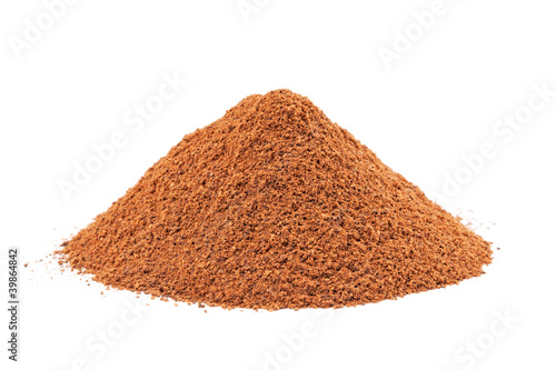 Heap of ground Cinnamon isolated on white background.