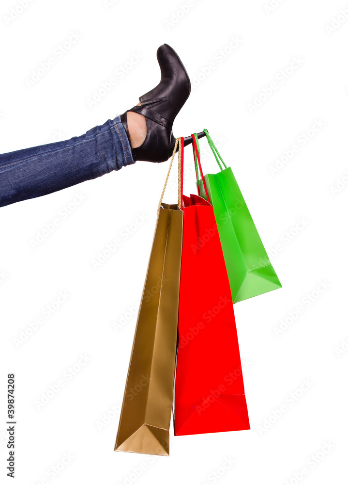 Concept of shopping bags on shoe high heels Concept of shopping bags on shoe high heels