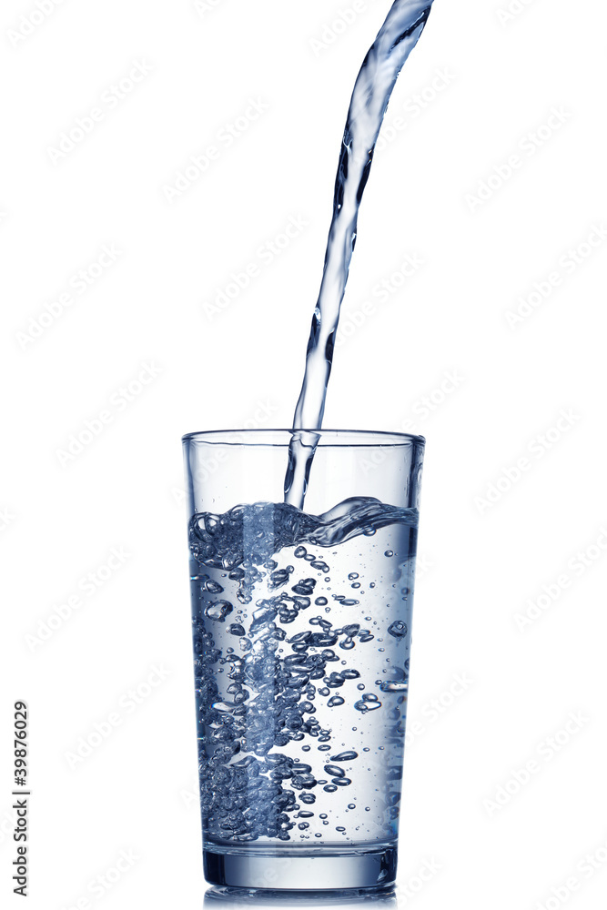 water pouring into glass isolated on white water pouring into glass isolated on white