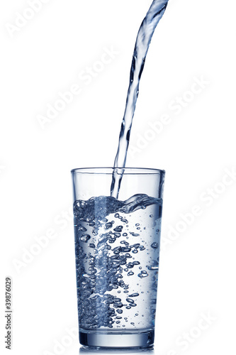 water pouring into glass isolated on white