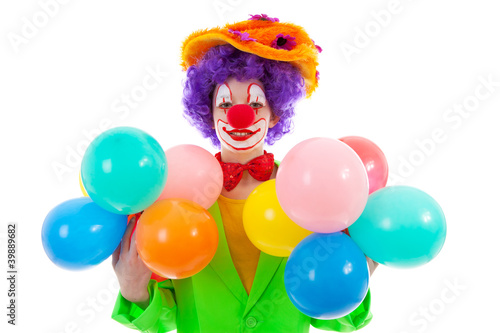 child dressed as colorful funny clown with balloons
