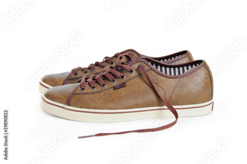 two brown sneakers isolated on white background