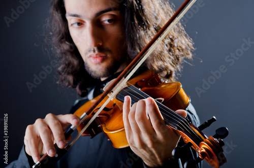 Violin player playing the intstrument photo