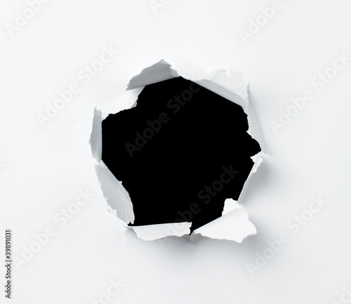 Hole in the paper sheet photo