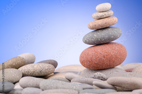 Pebbles stack against gradient background