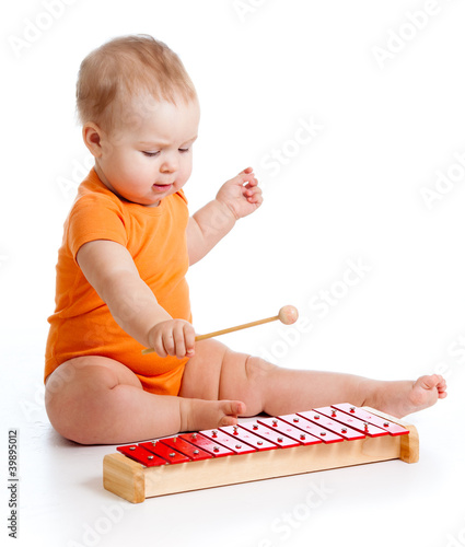 little girl playing on musi...