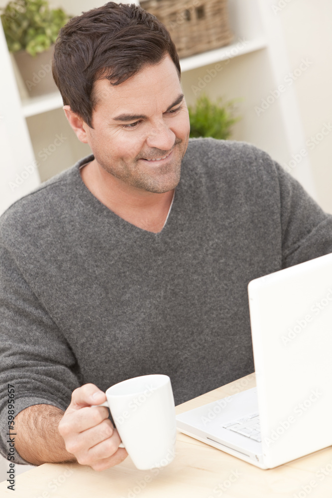 Man Using Laptop Computer At Home Man Using Laptop Computer At Home