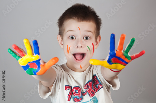child showing his colored hands