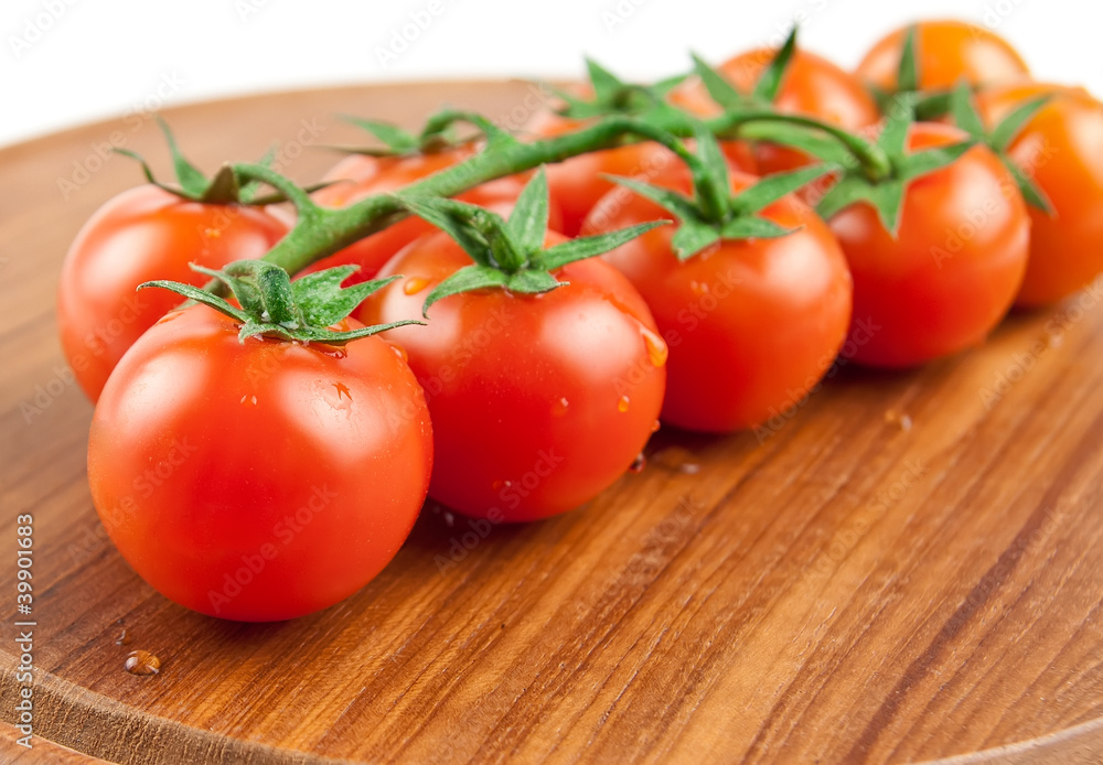 tomatoes on the wood cutting board tomatoes on the wood cutting board