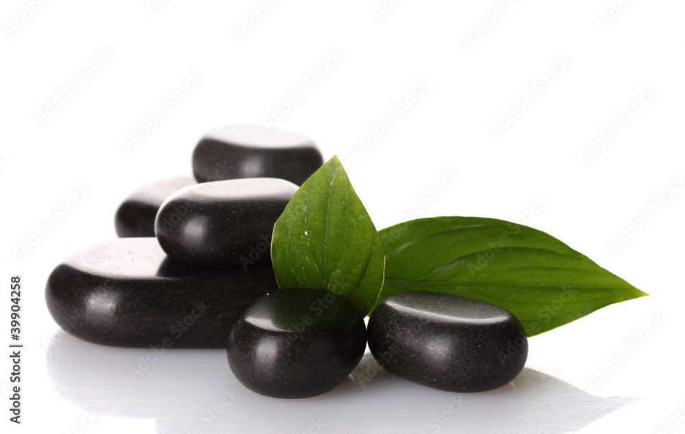 Spa stones and green leaves isolated on white Spa stones and green leaves isolated on white