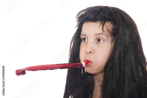 girl in a black wig and with a whistling pipe in a mouth photo