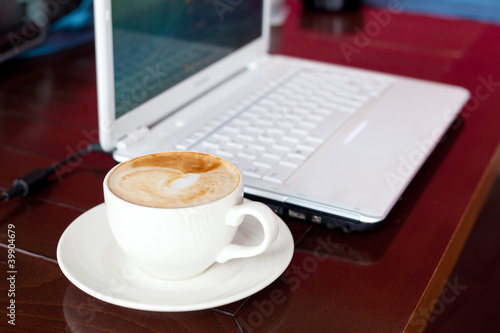 laptop and coffee on table